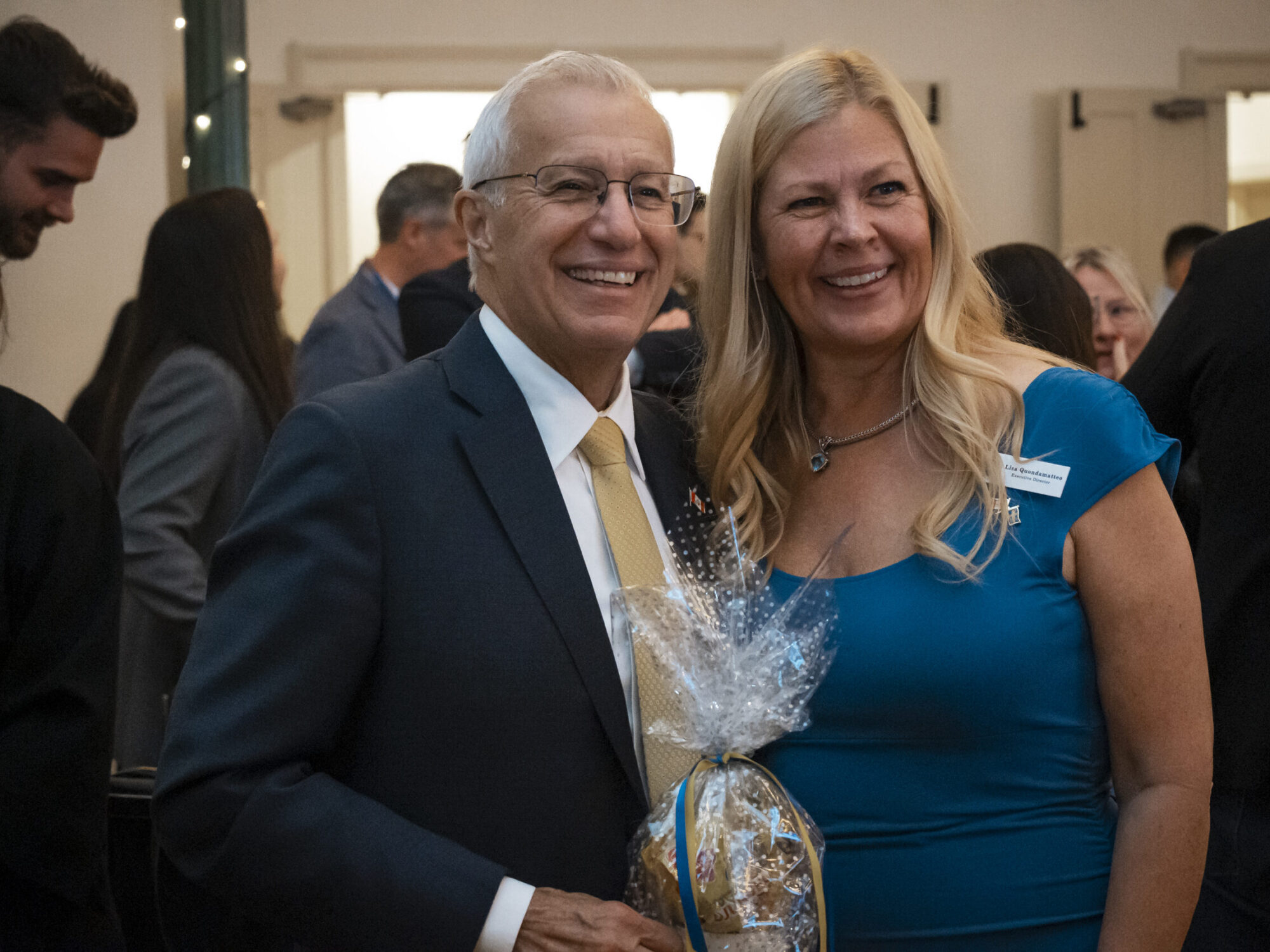 A man and a woman smiling for a photo. Vic Fedeli and Lisa are smiling for a photo.