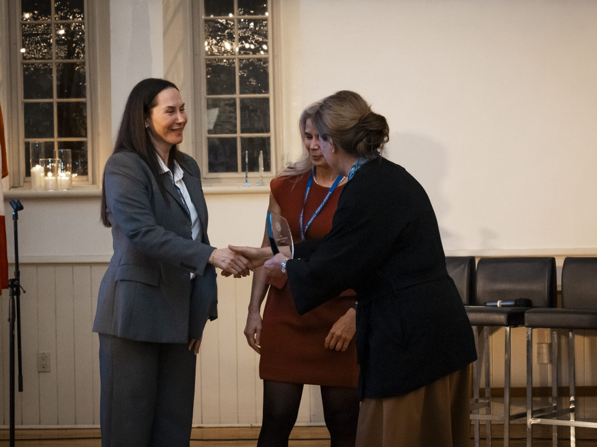 ferm-emelie_DSC2337_sccc-60th A woman receiving an award during the Swedish-Canadian Chamber of Commerce event.